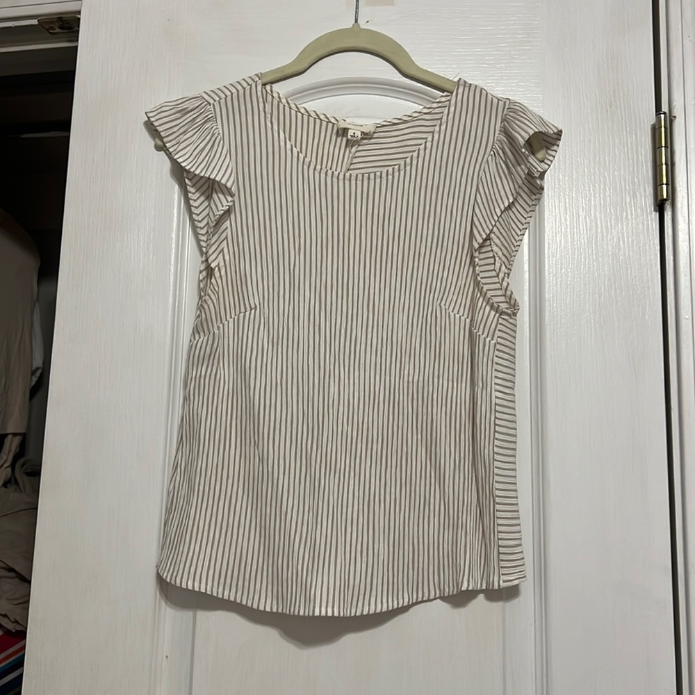 Size small white and beige stripe “le lis” top with ruffle shoulders